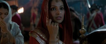 Movie still from “The Lovers” (2015), directed by Roland Joffé – A woman in a red sari with a gold ring on her finger; Close Up shot, Over the shoulder angle