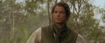 Movie still from “The Lovers” (2015), directed by Roland Joffé – A person wearing a vest; Close Up shot, Over the shoulder angle