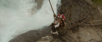 Movie still from “The Lovers” (2015), directed by Roland Joffé – Three people are on a raft in the middle of a river; Extreme Wide shot, Overhead angle