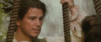 Movie still from “The Lovers” (2015), directed by Roland Joffé – A person holding a rope; Close Up shot, Low angle