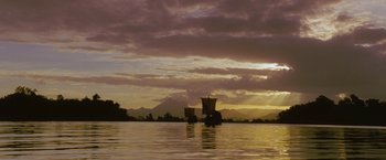 Movie still from “The Lovers” (2015), directed by Roland Joffé – Two boats in a body of water at sunset; Extreme Wide shot, Low angle
