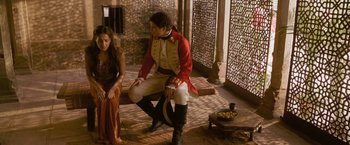 Movie still from “The Lovers” (2015), directed by Roland Joffé – A man in a red jacket and a woman in a white dress; Medium shot, Over the shoulder angle