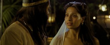 Movie still from “The Lovers” (2015), directed by Roland Joffé – A woman with a veil on her head looking at another woman with long dark hair; Close Up shot, Over the shoulder angle