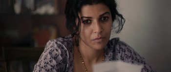 Movie still from “The Lunchbox” (2013), directed by Ritesh Batra – A person wearing a necklace; Close Up shot, High angle
