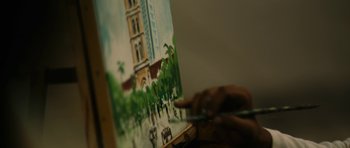 Movie still from “The Lunchbox” (2013), directed by Ritesh Batra – A person is painting a picture of a building; Extreme Close Up shot, Low angle
