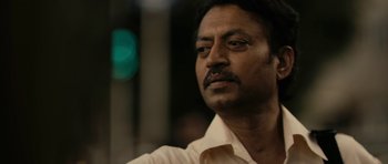 Movie still from “The Lunchbox” (2013), directed by Ritesh Batra – A person wearing a white shirt; Close Up shot, Low angle