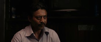 Movie still from “The Lunchbox” (2013), directed by Ritesh Batra – A person wearing a white shirt; Close Up shot, Over the shoulder angle