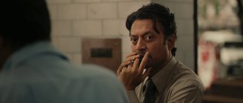 Movie still from “The Lunchbox” (2013), directed by Ritesh Batra – Irrfan khan smoking a cigarette; Close Up shot, Over the shoulder angle