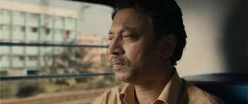 Movie still from “The Lunchbox” (2013), directed by Ritesh Batra – A person wearing a yellow shirt; Close Up shot, Low angle