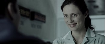 Movie still from “The Machinist” (2004), directed by Brad Anderson – A person wearing a white shirt; Close Up shot, Over the shoulder angle