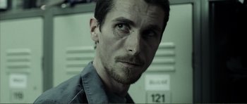 Movie still from “The Machinist” (2004), directed by Brad Anderson – A person wearing a shirt; Close Up shot, Low angle