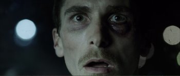 Movie still from “The Machinist” (2004), directed by Brad Anderson – A person's eyes and face; Close Up shot, Low angle