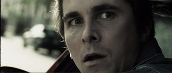 Movie still from “The Machinist” (2004), directed by Brad Anderson – A man's face looking up at the sky; Close Up shot, Low angle