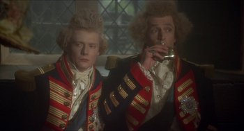 Movie still from “The Madness of King George” (1994), directed by Nicholas Hytner – Two men dressed in period costumes are smoking a cigarette; Medium shot, Low angle
