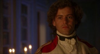 Movie still from “The Madness of King George” (1994), directed by Nicholas Hytner – A person wearing a suit and tie; Close Up shot, Over the shoulder angle