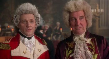 Movie still from “The Madness of King George” (1994), directed by Nicholas Hytner – A man and a woman dressed in period costumes; Close Up shot, Low angle