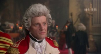 Movie still from “The Madness of King George” (1994), directed by Nicholas Hytner – A person wearing a suit and wig; Close Up shot, Over the shoulder angle