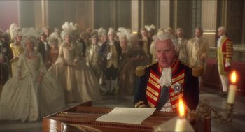 Movie still from “The Madness of King George” (1994), directed by Nicholas Hytner – An old man sitting at a piano in front of a crowd; Medium shot, High angle