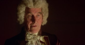 Movie still from “The Madness of King George” (1994), directed by Nicholas Hytner – An older man in a wig and a jacket; Close Up shot, Low angle
