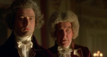 Movie still from “The Madness of King George” (1994), directed by Nicholas Hytner – Two men dressed up as beethoven and mozart; Close Up shot, Low angle