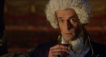 Movie still from “The Madness of King George” (1994), directed by Nicholas Hytner – A person holding a wine glass; Close Up shot, Over the shoulder angle