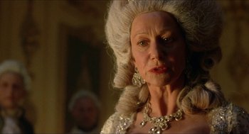 Movie still from “The Madness of King George” (1994), directed by Nicholas Hytner – An older woman wearing a white wig and a diamond necklace; Close Up shot, Low angle