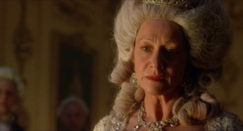 Movie still from “The Madness of King George” (1994), directed by Nicholas Hytner – An older woman in a white wig and a tiara; Close Up shot, Low angle