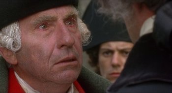 Movie still from “The Madness of King George” (1994), directed by Nicholas Hytner – A person with a hat on; Close Up shot, Over the shoulder angle