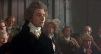 Movie still from “The Madness of King George” (1994), directed by Nicholas Hytner – A group of people standing next to each other in a room; Medium shot, Low angle