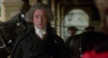 Movie still from “The Madness of King George” (1994), directed by Nicholas Hytner – A person wearing a coat; Close Up shot, Over the shoulder angle