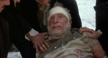 Movie still from “The Madness of King George” (1994), directed by Nicholas Hytner – An old man with a bandaged head and a woman holding him; Close Up shot, High angle