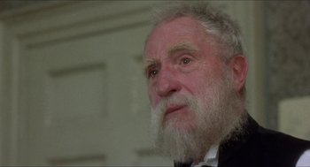 Movie still from “The Madness of King George” (1994), directed by Nicholas Hytner – An old man with a beard and a white mustache; Close Up shot, Over the shoulder angle