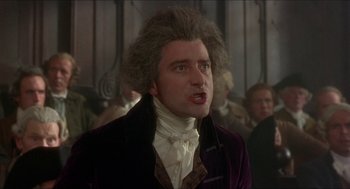 Movie still from “The Madness of King George” (1994), directed by Nicholas Hytner – A man in a purple jacket and a white shirt; Close Up shot, Low angle