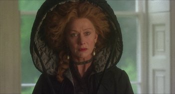 Movie still from “The Madness of King George” (1994), directed by Nicholas Hytner – An older woman wearing a black coat and a black hat; Close Up shot, Low angle
