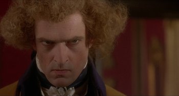 Movie still from “The Madness of King George” (1994), directed by Nicholas Hytner – A person wearing a wig; Close Up shot, Over the shoulder angle