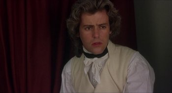 Movie still from “The Madness of King George” (1994), directed by Nicholas Hytner – A man in a white shirt and a black tie; Close Up shot, Over the shoulder angle