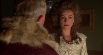 Movie still from “The Madness of King George” (1994), directed by Nicholas Hytner – A woman with long hair looking into a mirror; Close Up shot, Over the shoulder angle