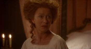 Movie still from “The Madness of King George” (1994), directed by Nicholas Hytner – A person wearing a dress; Close Up shot, Over the shoulder angle