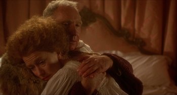 Movie still from “The Madness of King George” (1994), directed by Nicholas Hytner – An older man and a younger woman hugging; Close Up shot, High angle