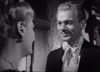 Movie still from “The Magnificent Ambersons” (1942), directed by Robert Wise – A man and a woman are talking to each other; Close Up shot, Over the shoulder angle