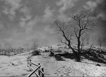 Movie still from “The Magnificent Ambersons” (1942), directed by Robert Wise – A black - and - white photo of a snowy landscape; Extreme Wide shot, High angle