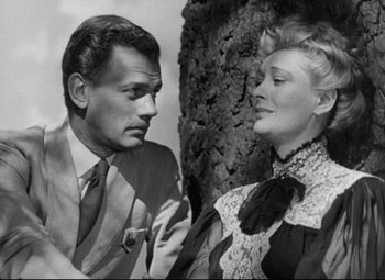 Movie still from “The Magnificent Ambersons” (1942), directed by Robert Wise – An old photo of a man and a woman; Close Up shot, High angle