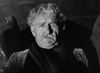 Movie still from “The Magnificent Ambersons” (1942), directed by Robert Wise – An older man with a beard and a mustache; Close Up shot, Low angle