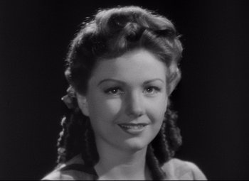 Movie still from “The Magnificent Ambersons” (1942), directed by Robert Wise – An old photo of an older woman with long hair; Close Up shot, Low angle