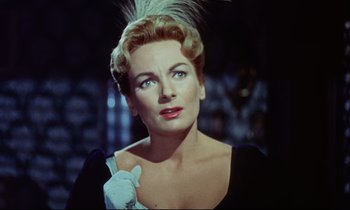Movie still from “The Man Who Could Cheat Death” (1959), directed by Terence Fisher – A person wearing a dress; Close Up shot, Low angle