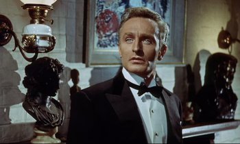 Movie still from “The Man Who Could Cheat Death” (1959), directed by Terence Fisher – A person wearing a suit and tie; Close Up shot, Low angle