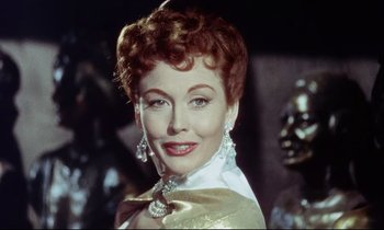 Movie still from “The Man Who Could Cheat Death” (1959), directed by Terence Fisher – A person wearing a dress; Close Up shot, Low angle