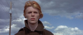 Movie still from “The Man Who Fell to Earth” (1976), directed by Nicolas Roeg – A person wearing a jacket; Close Up shot, Low angle
