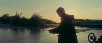 Movie still from “The Man Who Fell to Earth” (1976), directed by Nicolas Roeg – A man standing next to a body of water; Wide shot, Low angle