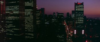 Movie still from “The Man Who Fell to Earth” (1976), directed by Nicolas Roeg – A view of a city at night from a window; Extreme Wide shot, High angle